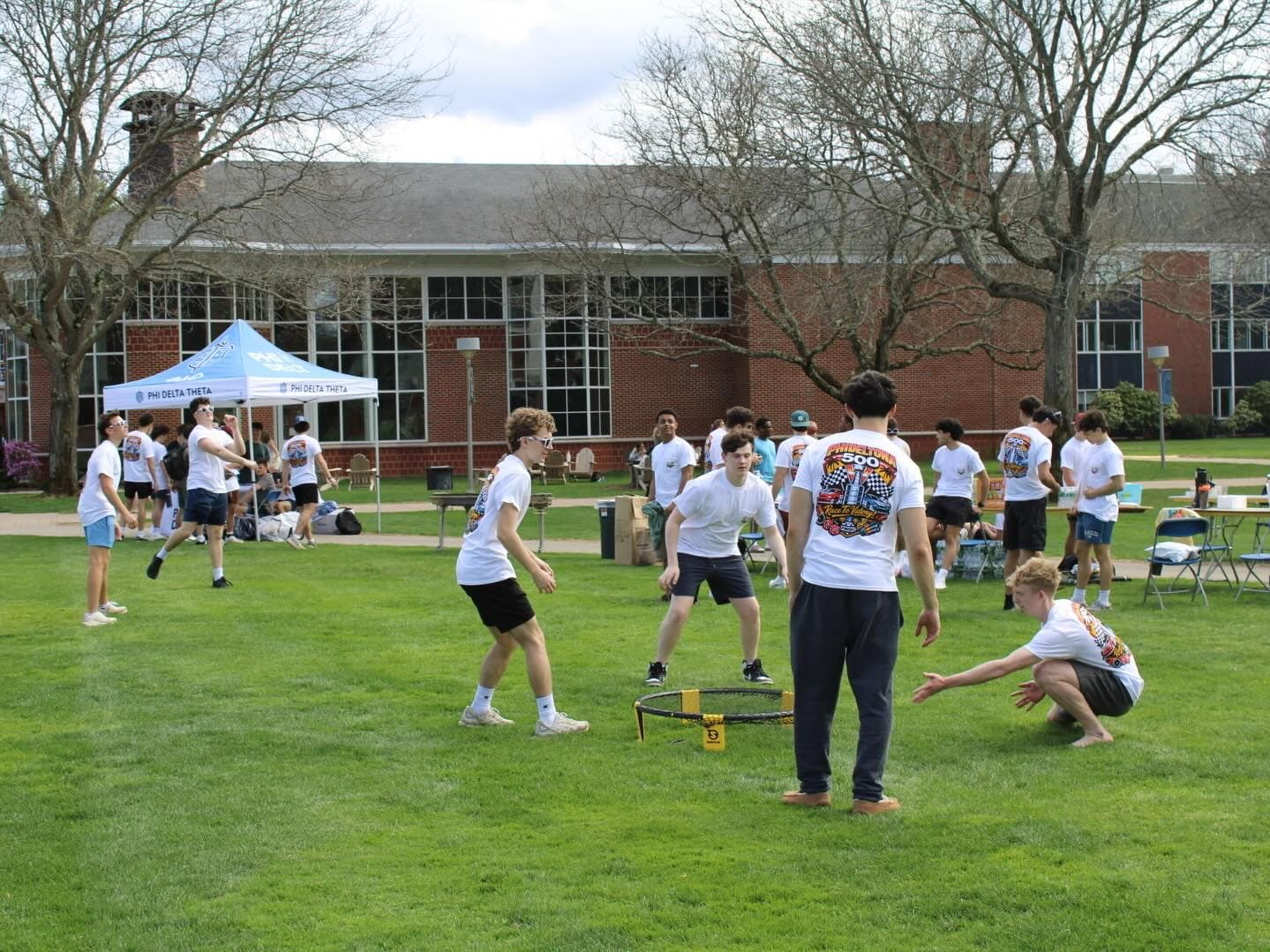 Brothers enjoying a chapter event on the Quinnipiac quad