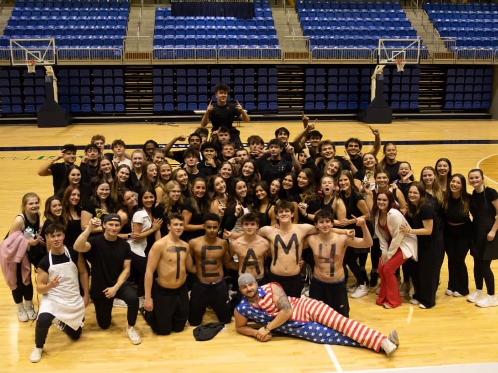 Phi Delta Theta brothers participating with the wider Quinnipiac campus community